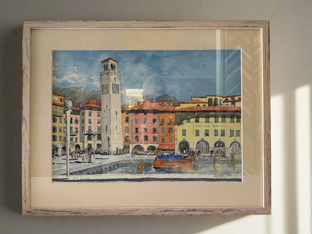 Framed painting of a cityscape with a clock tower and canal.