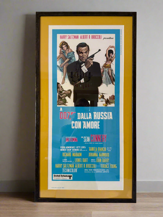 Framed and mounted Italian version poster of the 1963 James Bond film 'From Russia With Love', featuring iconic imagery of Bond and a blue background.