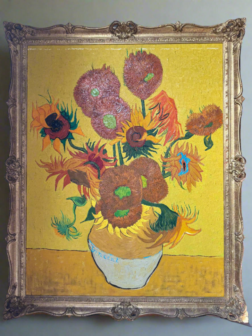 Framed artwork resembling Van Gogh's 'Sunflowers' on a yellow background