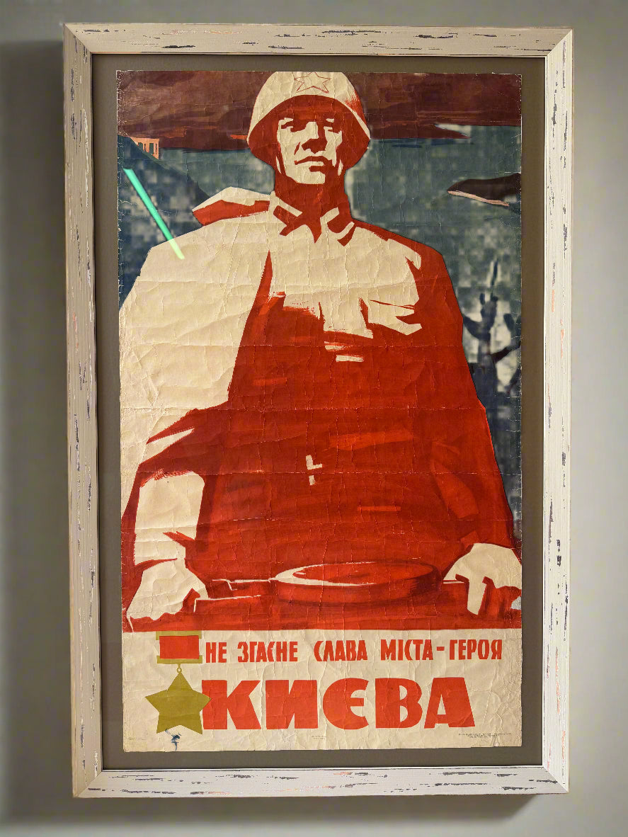Framed vintage-style poster with a stylized illustration of a person wearing a red coat.