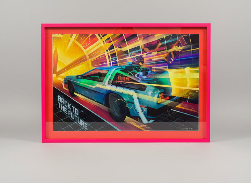 Back to the Future (1985) poster. Limited edition foil version numbered 22/150. Vibrant pink box-style frame. [stock ref no: 46]